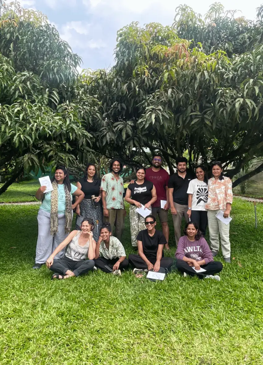 A team session under the mango trees, workshop style.