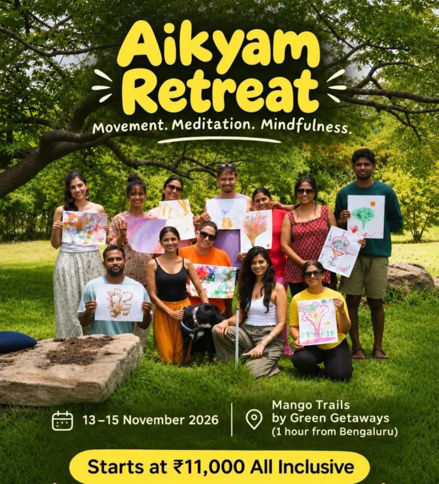 Aikyam Retreat: guests holding up their nature art on the lawn at Mango Trails